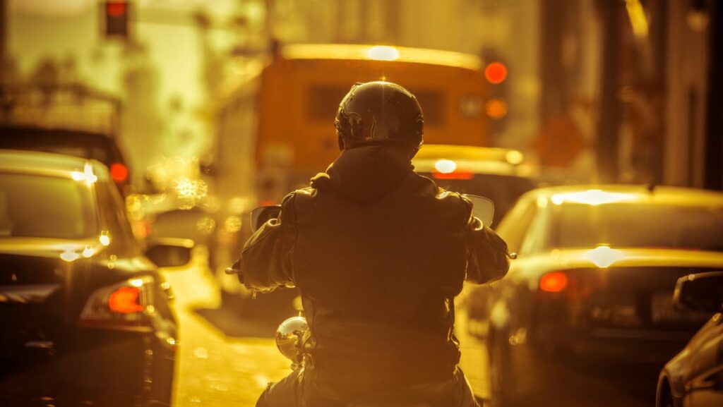 Motorcycle rider lane splitting which may cause accident requiring car accident lawyer, Houston motorcycle accident lawyer