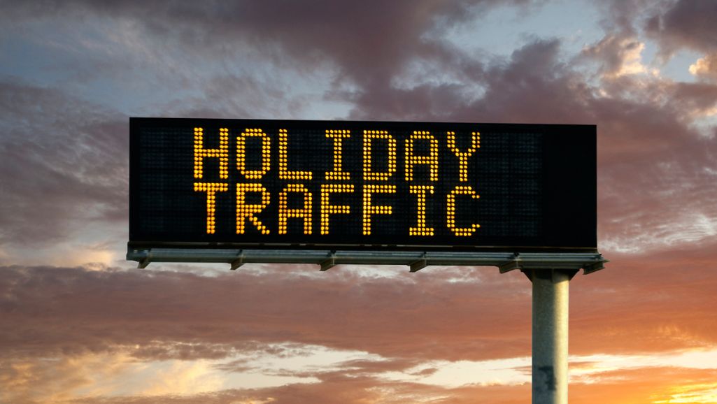 sign warning of holiday traffic to prevent need for car accident lawyer