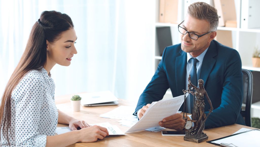 Houston accident lawyer talking with woman
