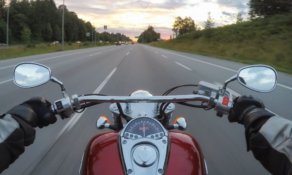 motorcyclist riding down road feeling secure thanks to support of Sugar Land personal injury lawyer