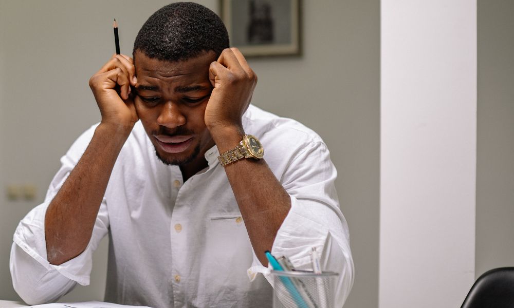 man feeling stressed needing to talk to 18 wheeler accident attorney